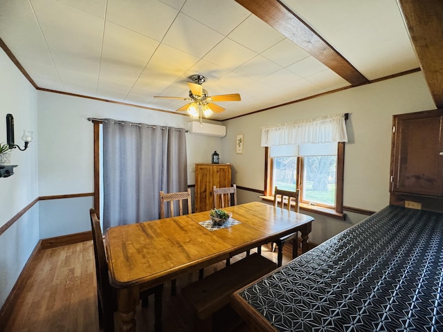 30 Washington St, Caribou, ME 04736 - dining space with a wall mounted air conditioner, ornamental molding, wood finished floors, ceiling fan, and baseboards