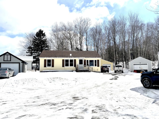 view of front of house featuring a garage, an outdoor structure, and a porch