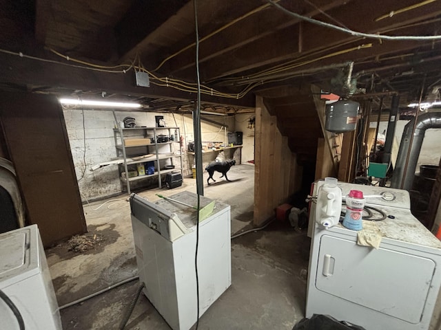 unfinished basement with independent washer and dryer