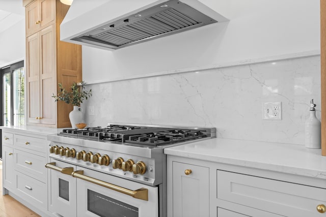 65 Sky Dr, Windham, ME 04062 - kitchen with double oven range, custom exhaust hood, light stone counters, and backsplash
