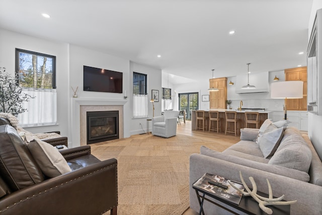 65 Sky Dr, Windham, ME 04062 - living area with a fireplace with flush hearth, recessed lighting, and baseboards