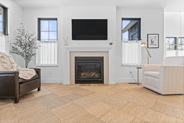 65 Sky Dr, Windham, ME 04062 - living room featuring a glass covered fireplace and baseboards