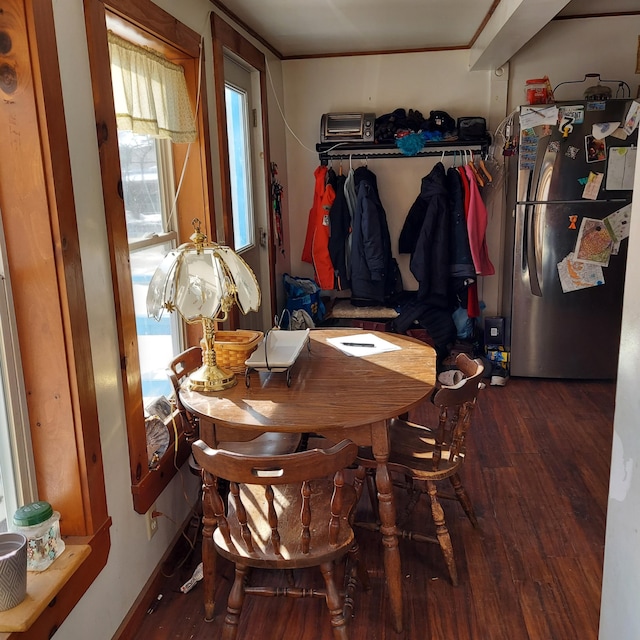 dining area with hardwood / wood-style flooring