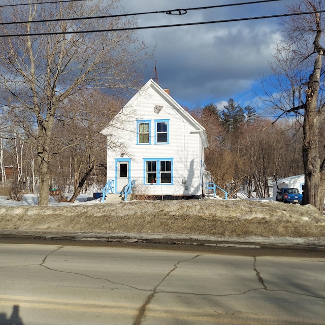 view of front of home with a chimney