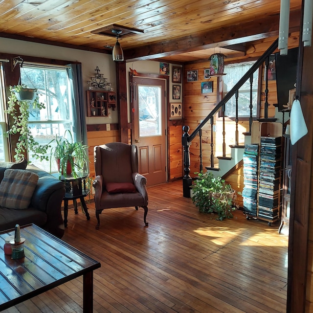 living room featuring wooden ceiling, stairway, a healthy amount of sunlight, and wood-type flooring