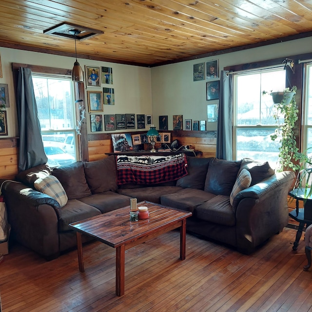 living room with plenty of natural light, wood ceiling, and hardwood / wood-style flooring