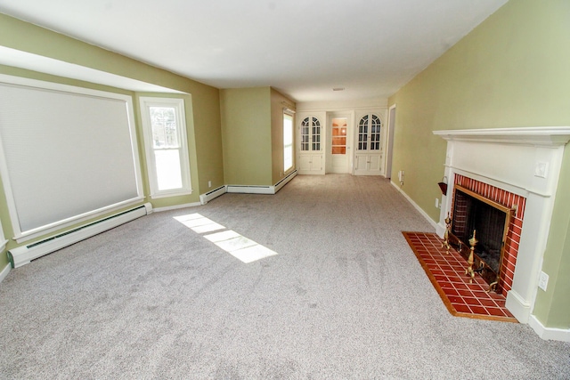 unfurnished living room with carpet, a brick fireplace, and baseboard heating