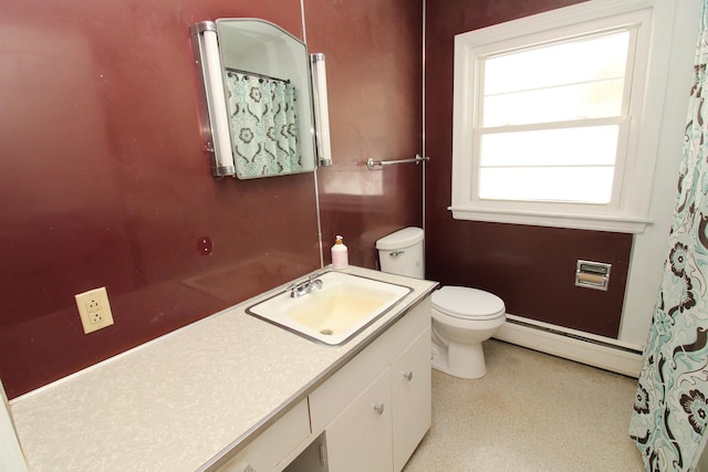 full bath featuring a baseboard radiator, vanity, and toilet