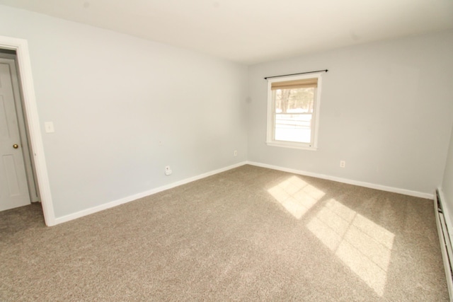 unfurnished room with carpet, baseboards, and baseboard heating