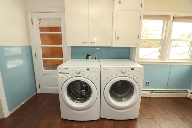 laundry room with dark wood-style floors, cabinet space, a baseboard heating unit, washer and dryer, and baseboards