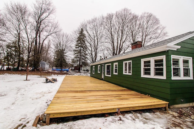 view of snow covered deck