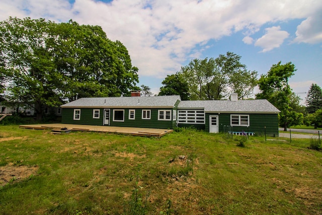 269 Main St, Orono, ME 04473 - back of house with a chimney and a wooden deck