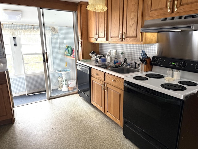 kitchen with black appliances, under cabinet range hood, a sink, brown cabinetry, and light countertops