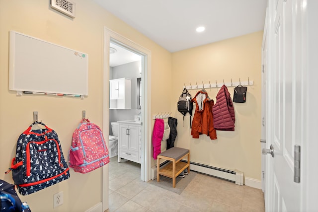 mudroom featuring light tile patterned floors, baseboard heating, baseboards, and visible vents