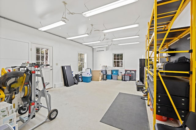 garage featuring a wall mounted air conditioner