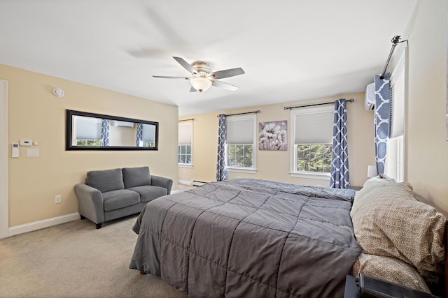 carpeted bedroom with a baseboard heating unit, baseboards, a ceiling fan, and a wall mounted AC