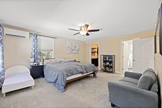 bedroom featuring a wall mounted AC, ensuite bath, a baseboard radiator, light colored carpet, and ceiling fan