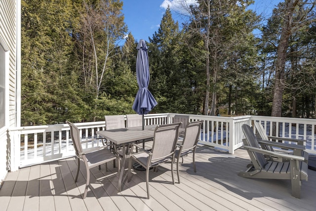 wooden deck featuring outdoor dining space