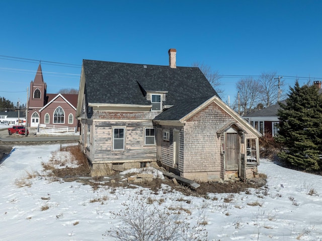 view of front of home featuring a chimney