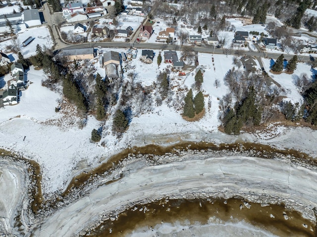 snowy aerial view featuring a residential view