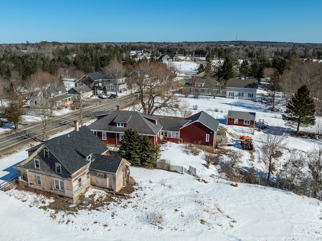 snowy aerial view featuring a residential view