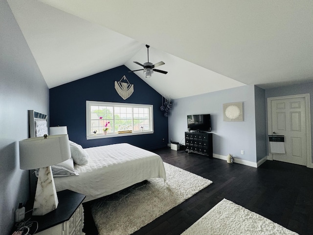 bedroom with ceiling fan, lofted ceiling, baseboards, heating unit, and dark wood-style floors