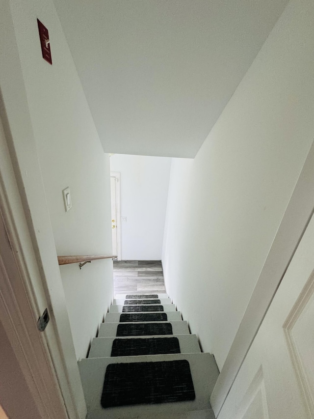 stairs with wood finished floors