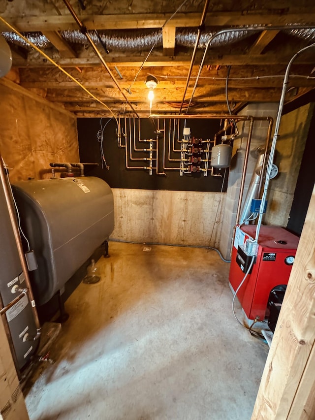 unfinished basement featuring a heating unit and heating fuel