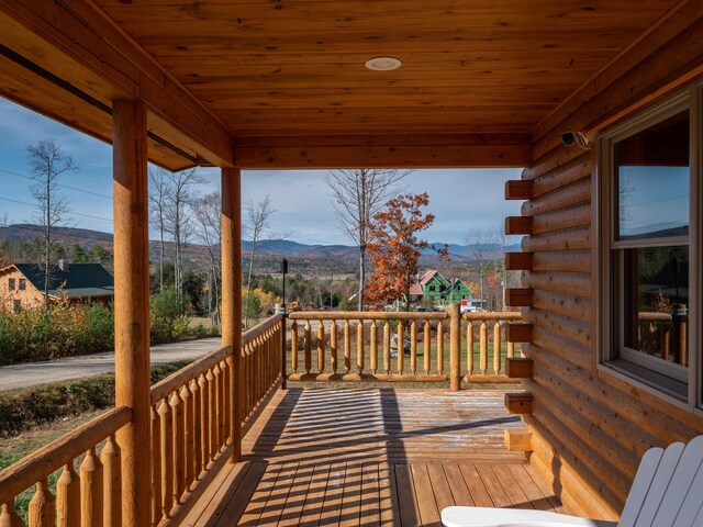 wooden terrace featuring a mountain view