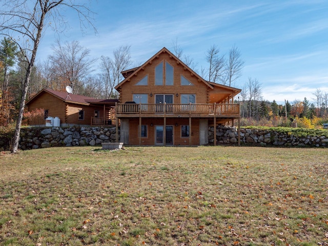 back of house with a deck, log exterior, and a lawn