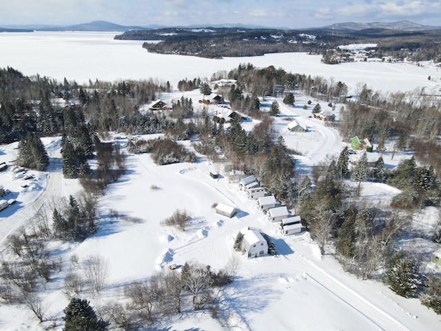 snowy aerial view with a mountain view