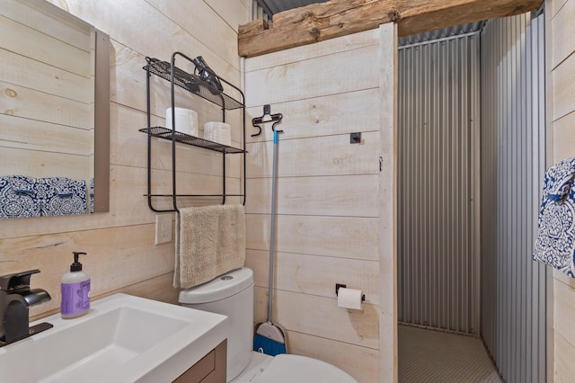 2342 Main St, Rangeley, ME 04970 - bathroom featuring toilet, wooden walls, and vanity