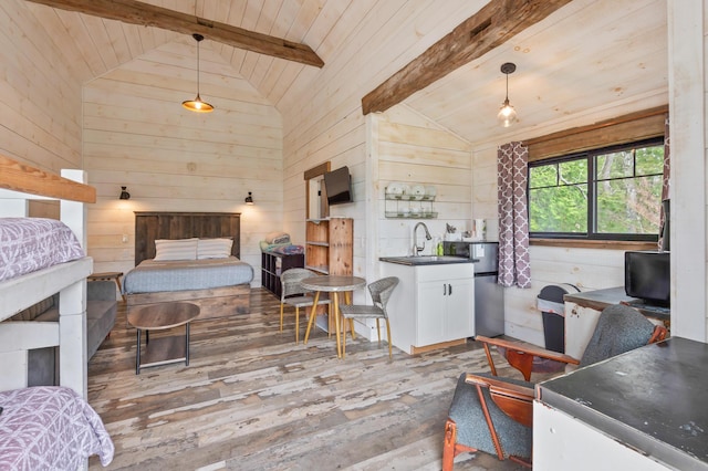 2342 Main St, Rangeley, ME 04970 - bedroom featuring hardwood / wood-style floors, wooden walls, wood ceiling, freestanding refrigerator, and a sink