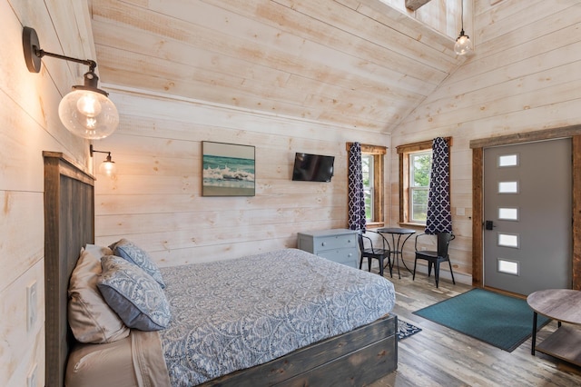 2342 Main St, Rangeley, ME 04970 - bedroom featuring wood finished floors, lofted ceiling, and wooden walls