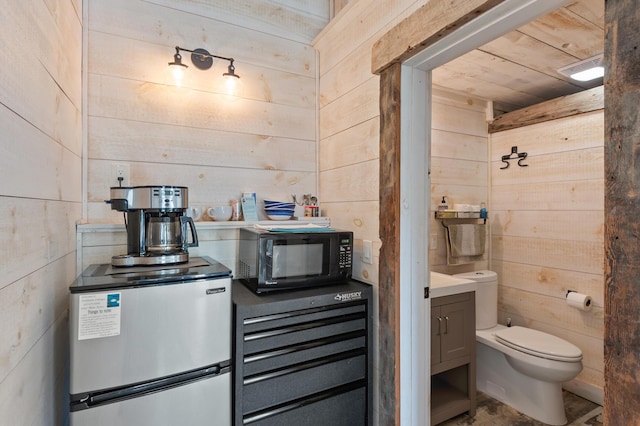 2342 Main St, Rangeley, ME 04970 - bathroom with wooden walls and toilet