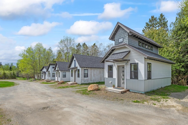 2342 Main St, Rangeley, ME 04970 - view of front of home with driveway and a shingled roof