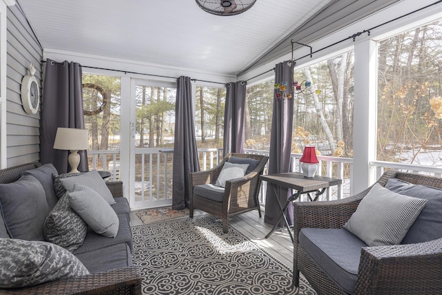 sunroom featuring lofted ceiling