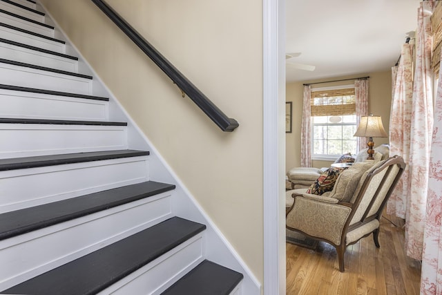 stairs with wood finished floors