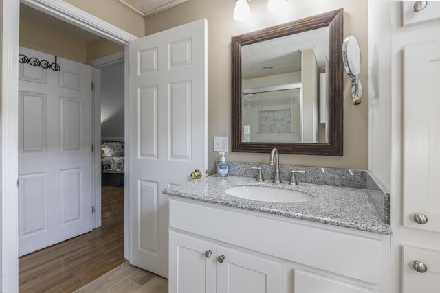 bathroom featuring vanity and wood finished floors