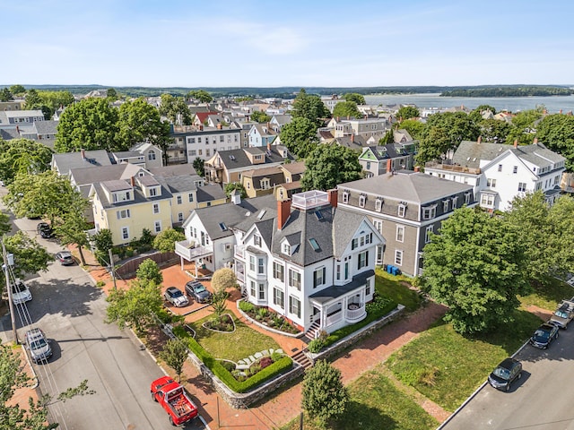 aerial view with a residential view and a water view