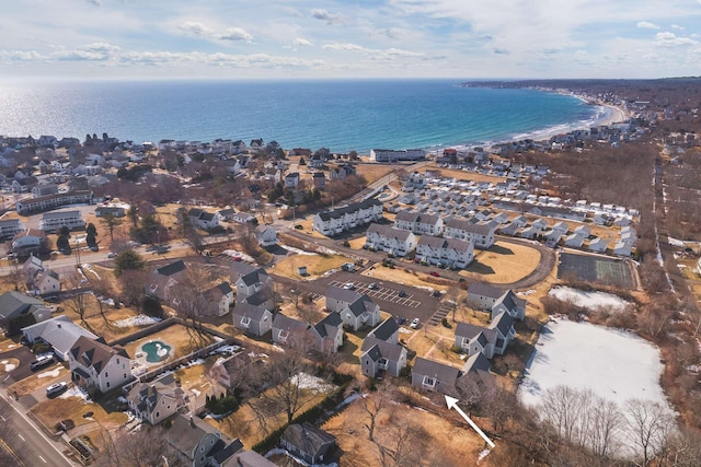 drone / aerial view with a residential view and a water view