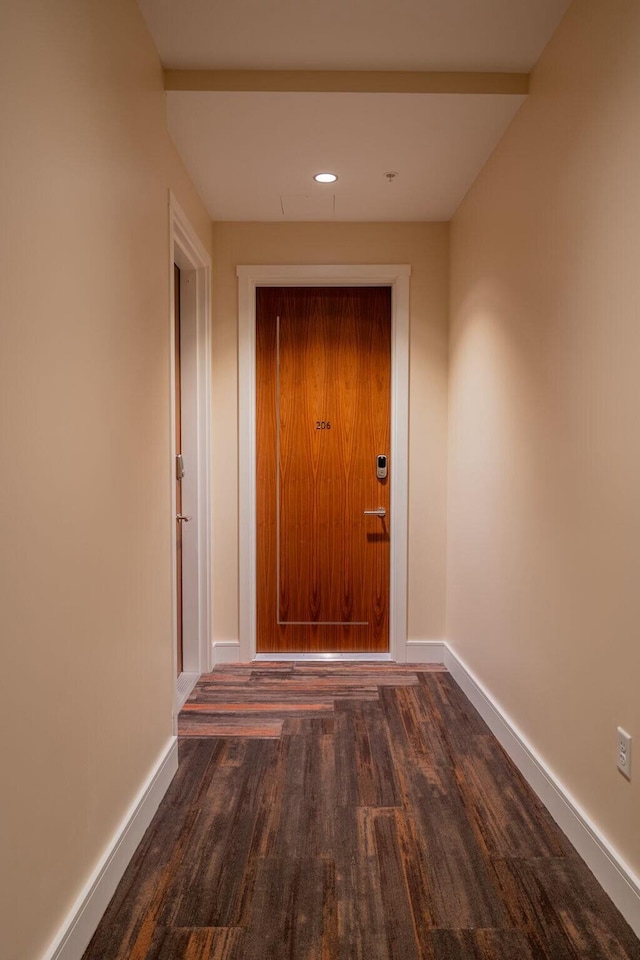 entryway featuring recessed lighting, baseboards, and wood finished floors