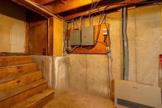 unfinished basement with electric panel and stairs