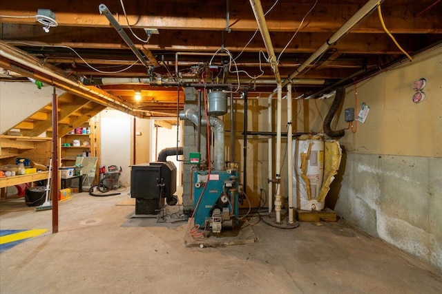 unfinished basement featuring electric water heater and a heating unit