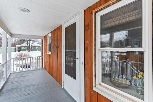 wooden deck featuring covered porch