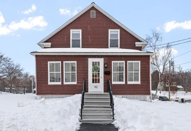 view of front of home featuring fence