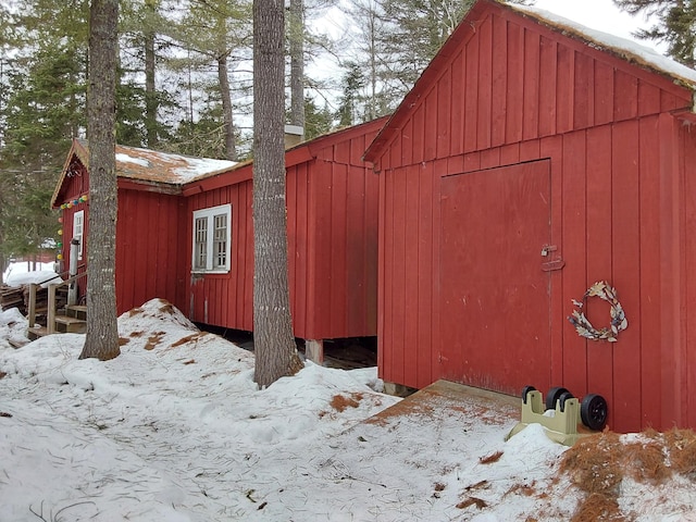 snow covered structure with an outdoor structure