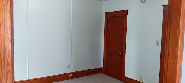 unfurnished room with carpet flooring