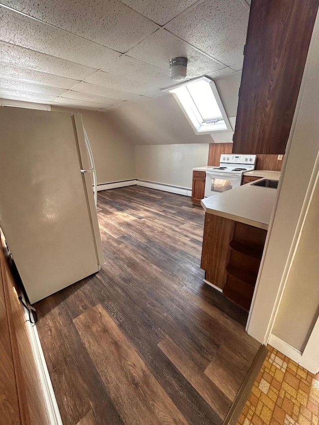 bonus room featuring a baseboard heating unit, lofted ceiling with skylight, and dark wood-style flooring