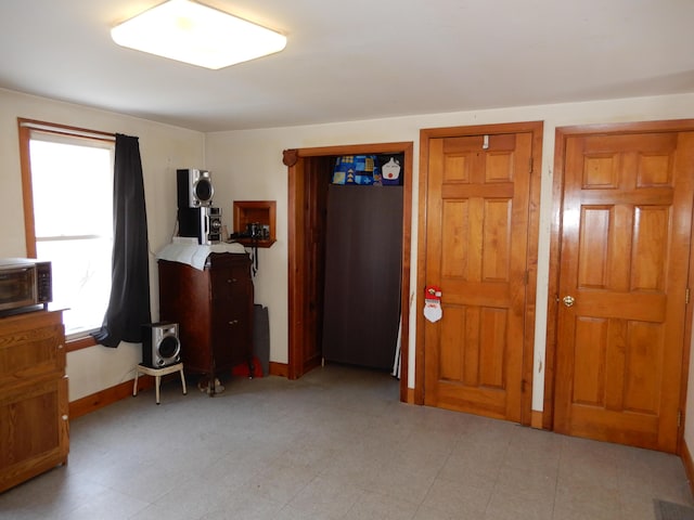 bedroom with baseboards and visible vents